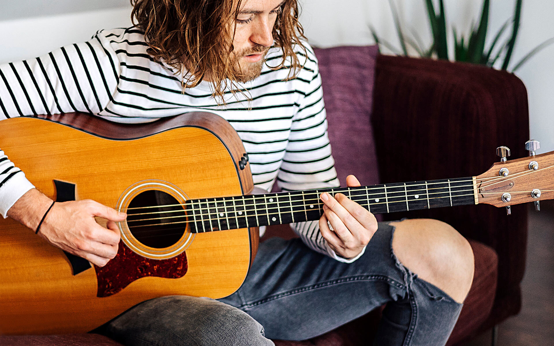 A musician using guitar chord inversions