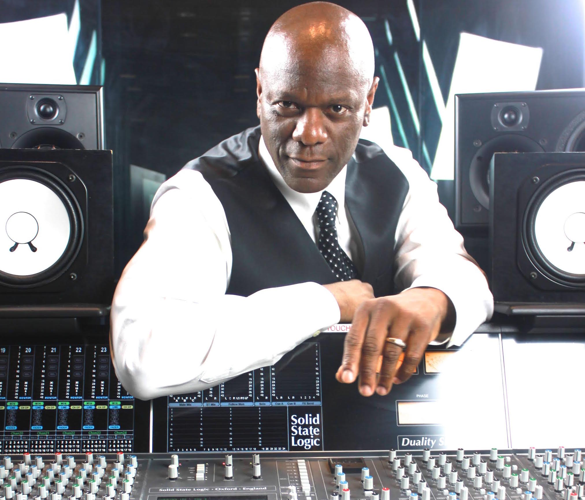 Berklee Online course author Prince Charles Alexander is shown presiding over the mixing desk.