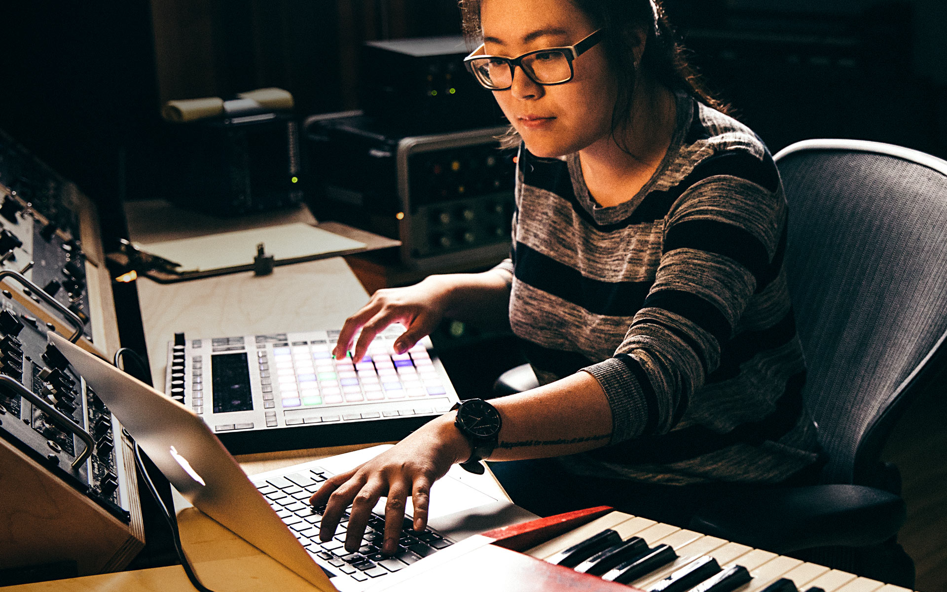 Woman scoring music for video games.