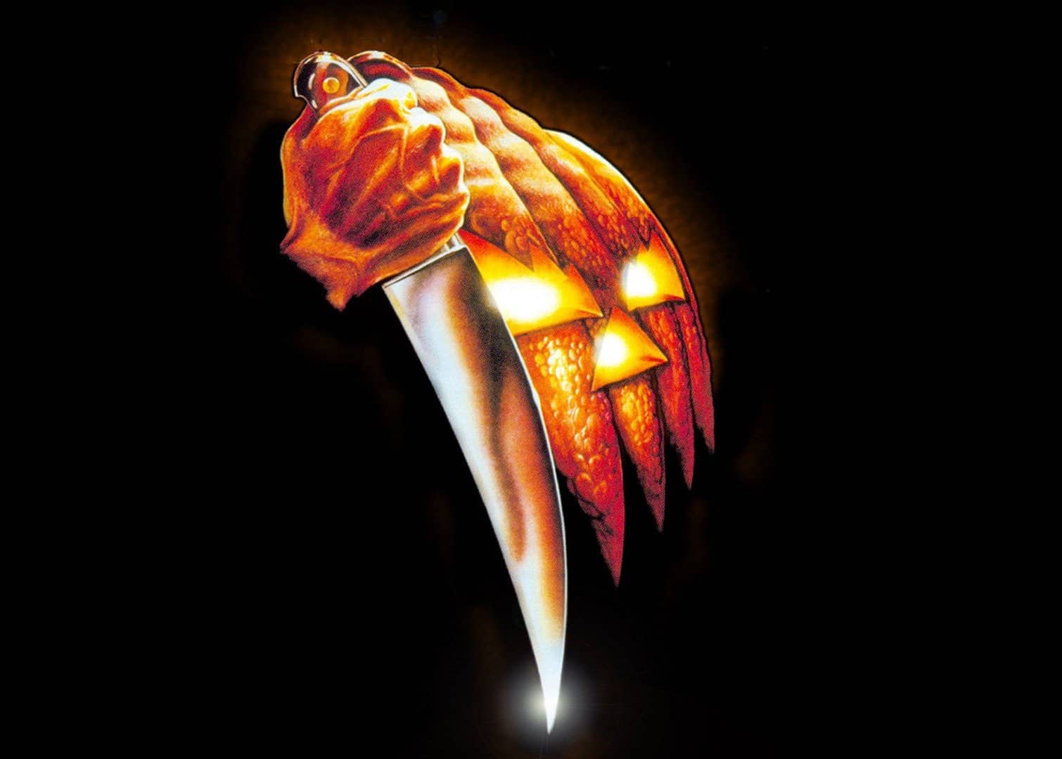 The 1978 "Halloween" movie image of a jack-o'-lantern figure holding a knife.