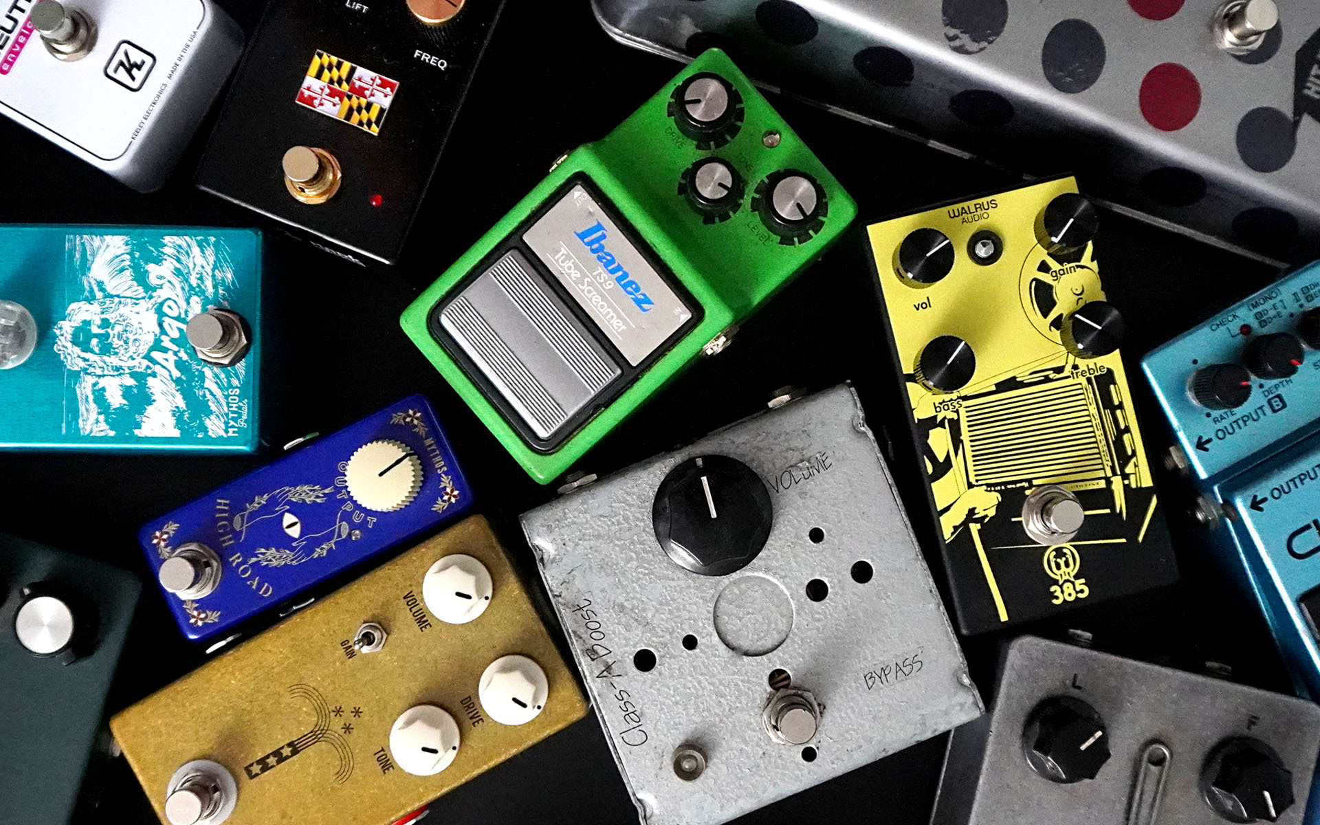 Some of the guitar pedals that Berklee Online Academic Adviser and guitarist Mark Hopkins has bought over the years are shown in a pile.