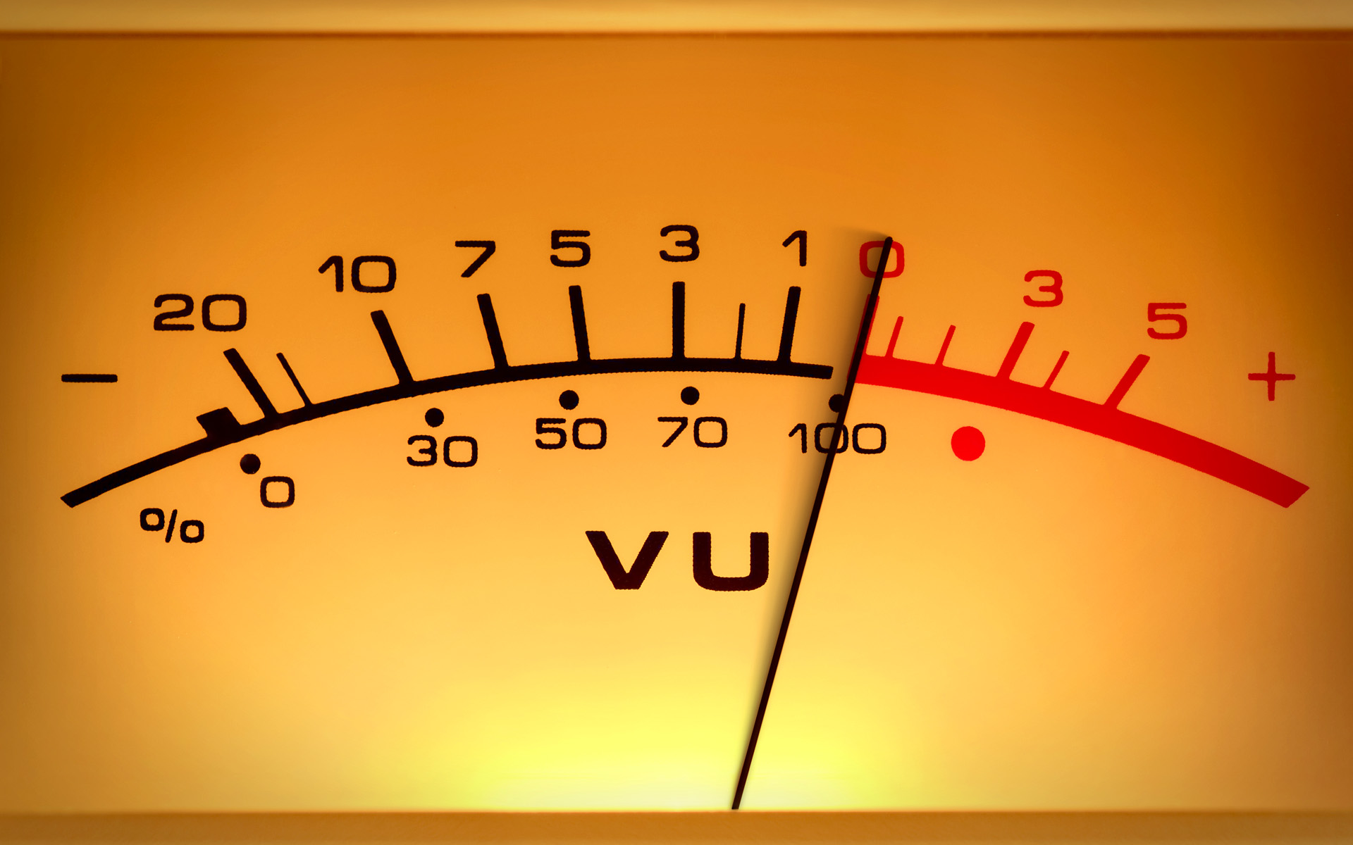 A VU meter on a stereo console shows the levels of a song when audio mastering techniques have been executed.