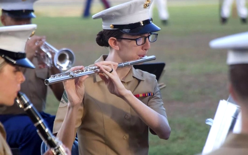 Avalon Reed playing flute with the Marine Corps Band. 