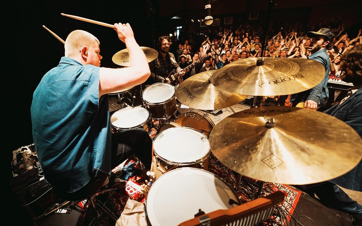 Jordan Rose drumming onstage