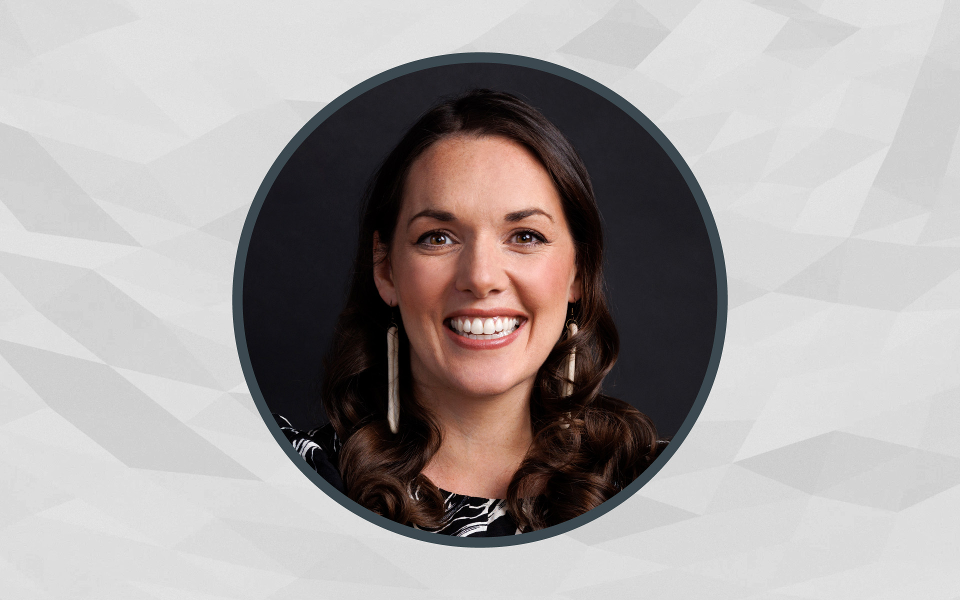 A portrait of Berklee Online instructor Maria Finelmeier framed inside of a circle, with a gray background.