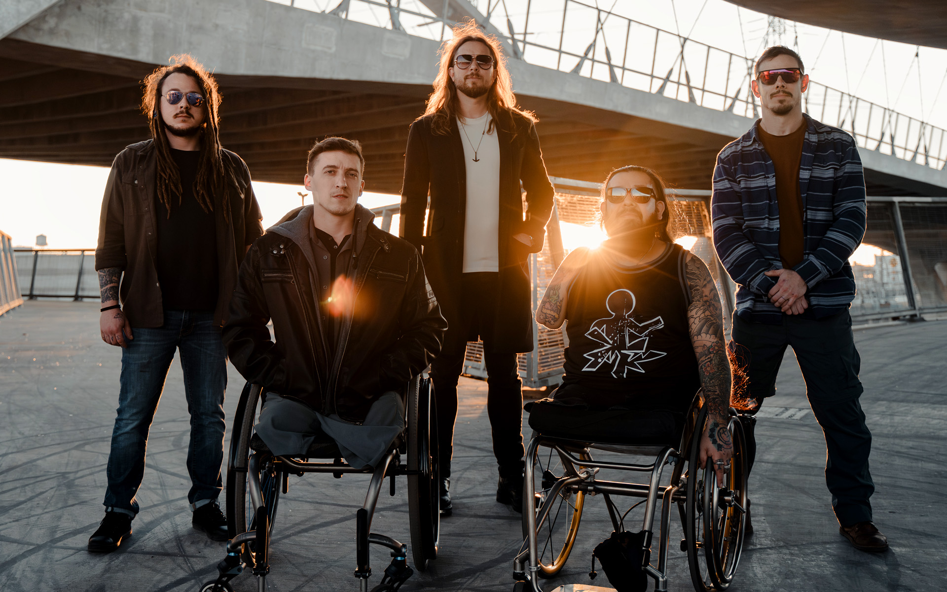 The Resilient are a five-piece band, pictured against the sunset.