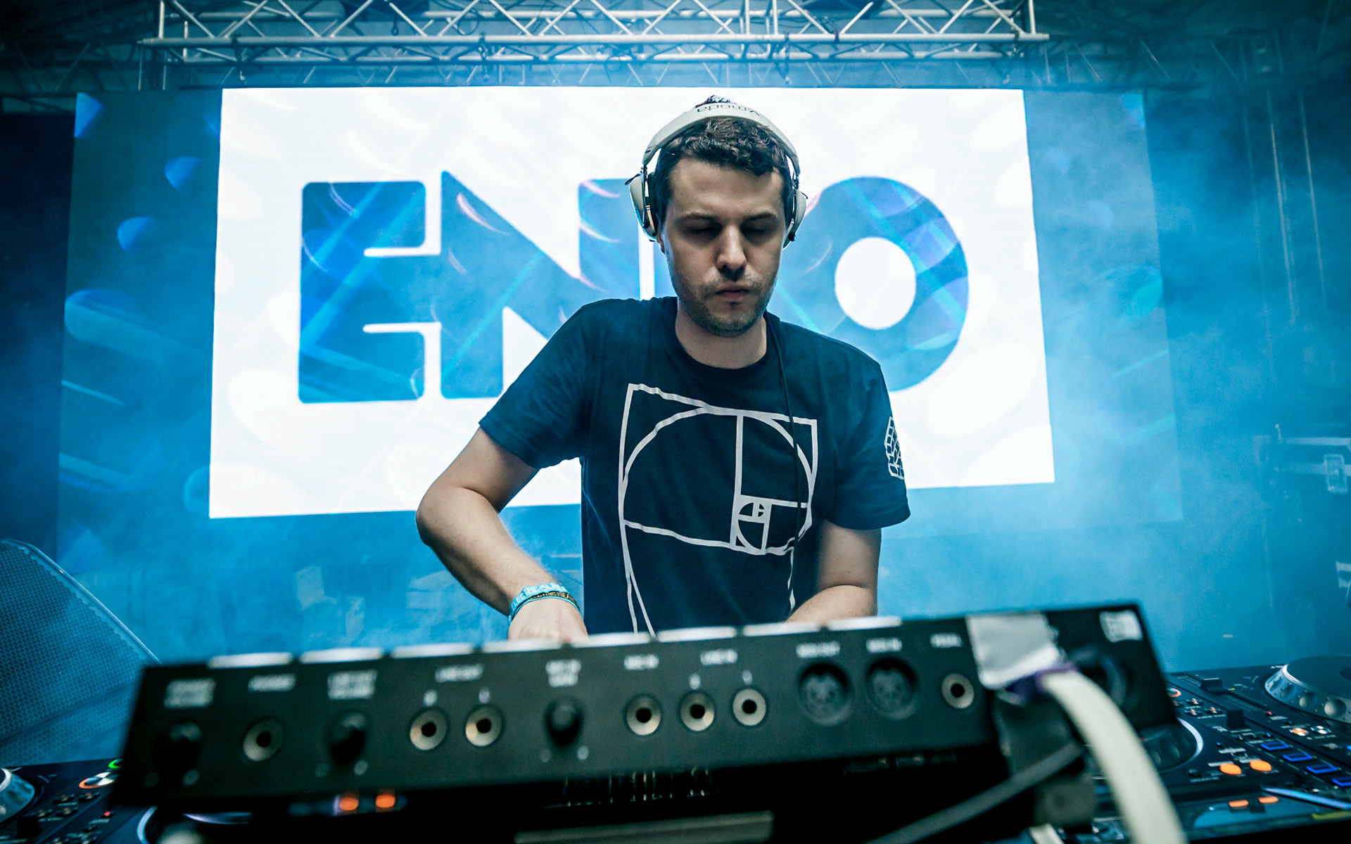 Mike Henderson (a.k.a. DJ ENDO) focuses on his console while DJing a club.