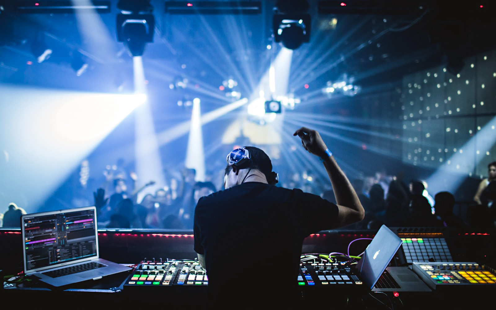 Mike Henderson (a.k.a. DJ ENDO) rocks out while DJing a club.