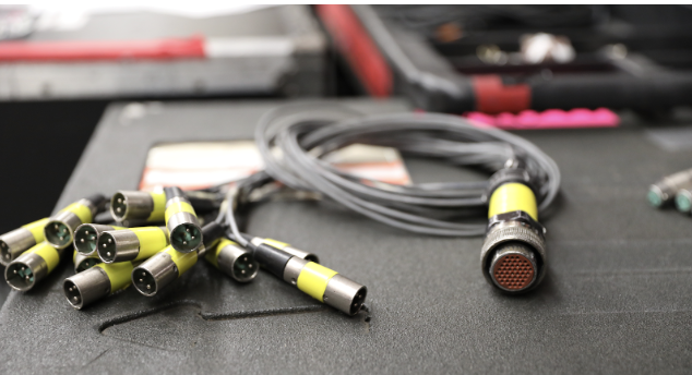 A picture of a silver 14-channel fan out plugs with yellow ends is portrayed