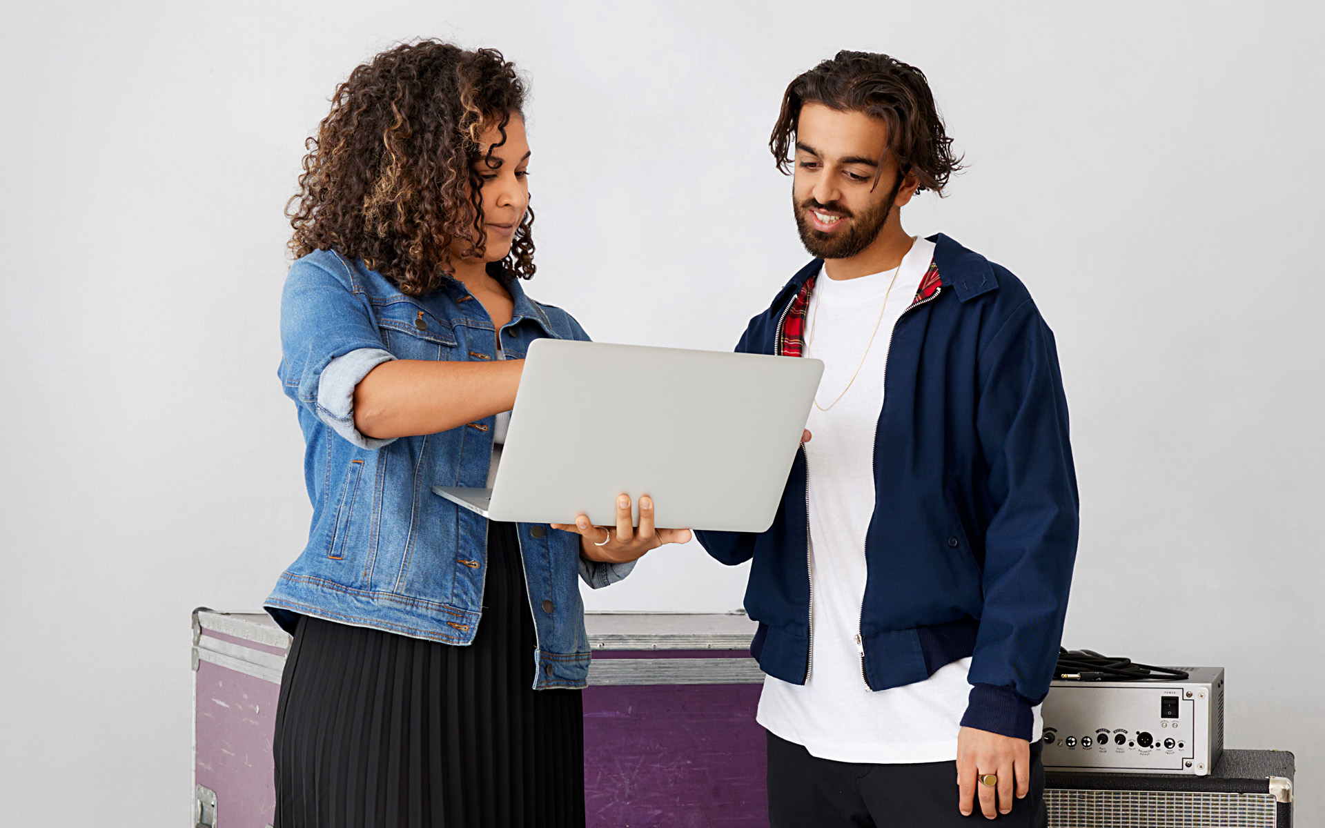 An artist manager helps their artist understand a tour itinerary or a music business contract.