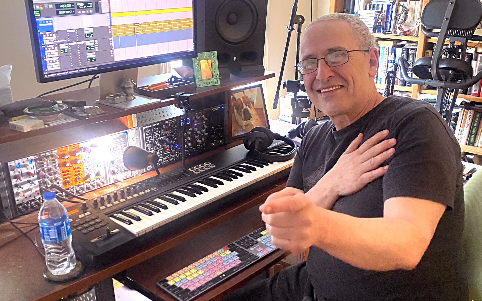 Paul Zarvis sitting in front of his studio set up. 