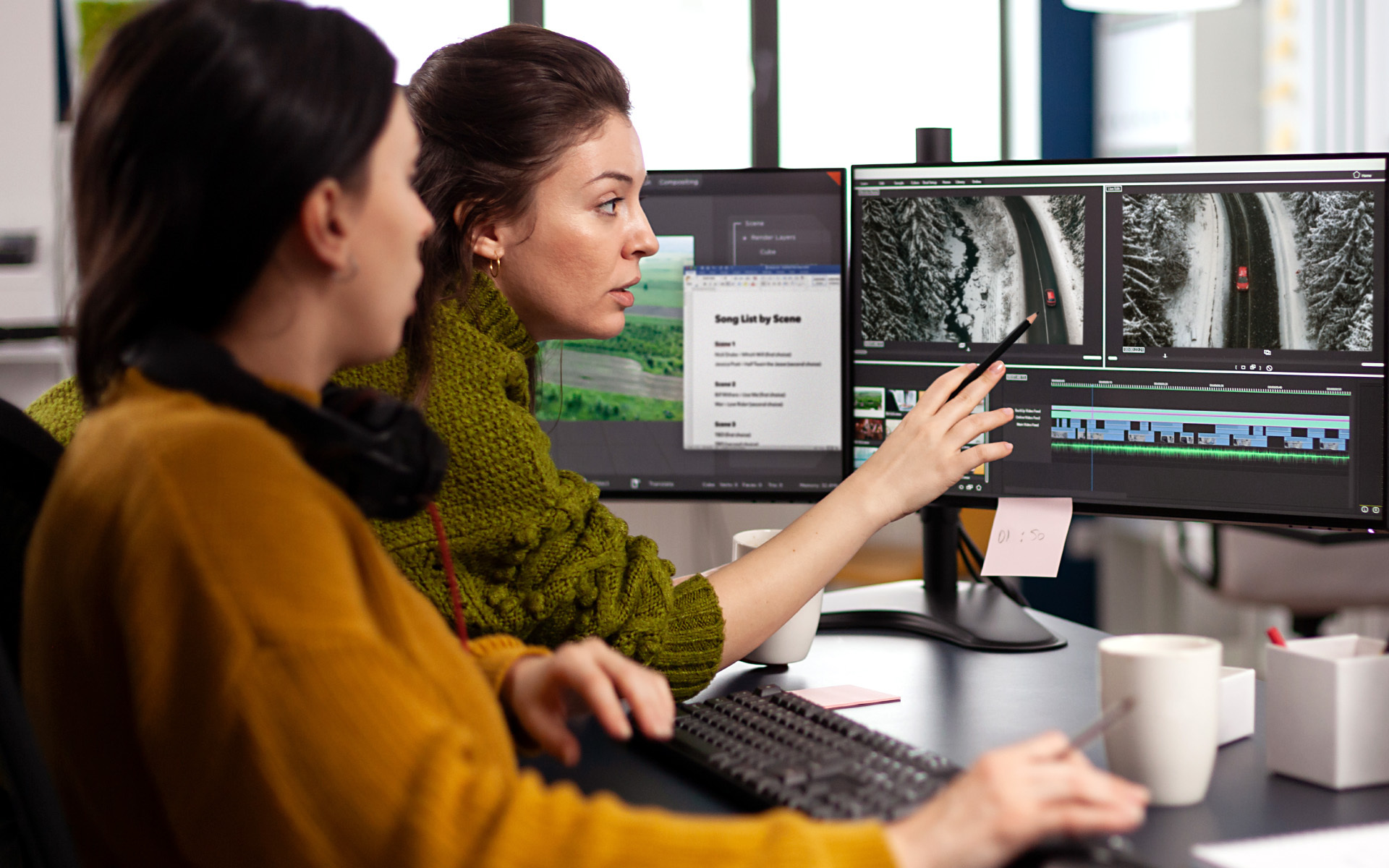 Image of two women working on a computer
