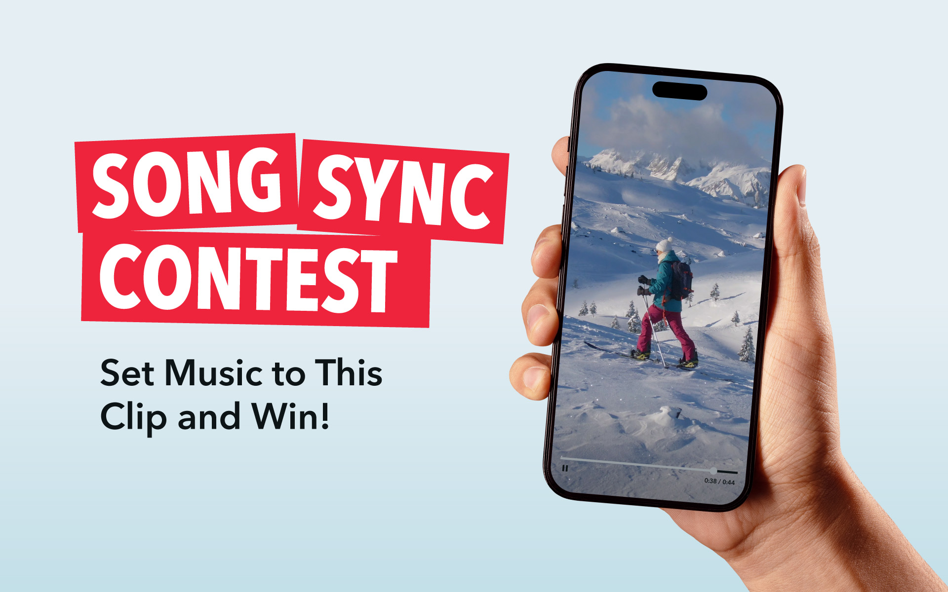 Can You Pick the Perfect Song? Enter Our Music Supervision Song Sync Contest A hand holds out a phone, with an image of a skiier on the mountains and text announces: Song Sync Contest: Set Music to This Clip and Win!