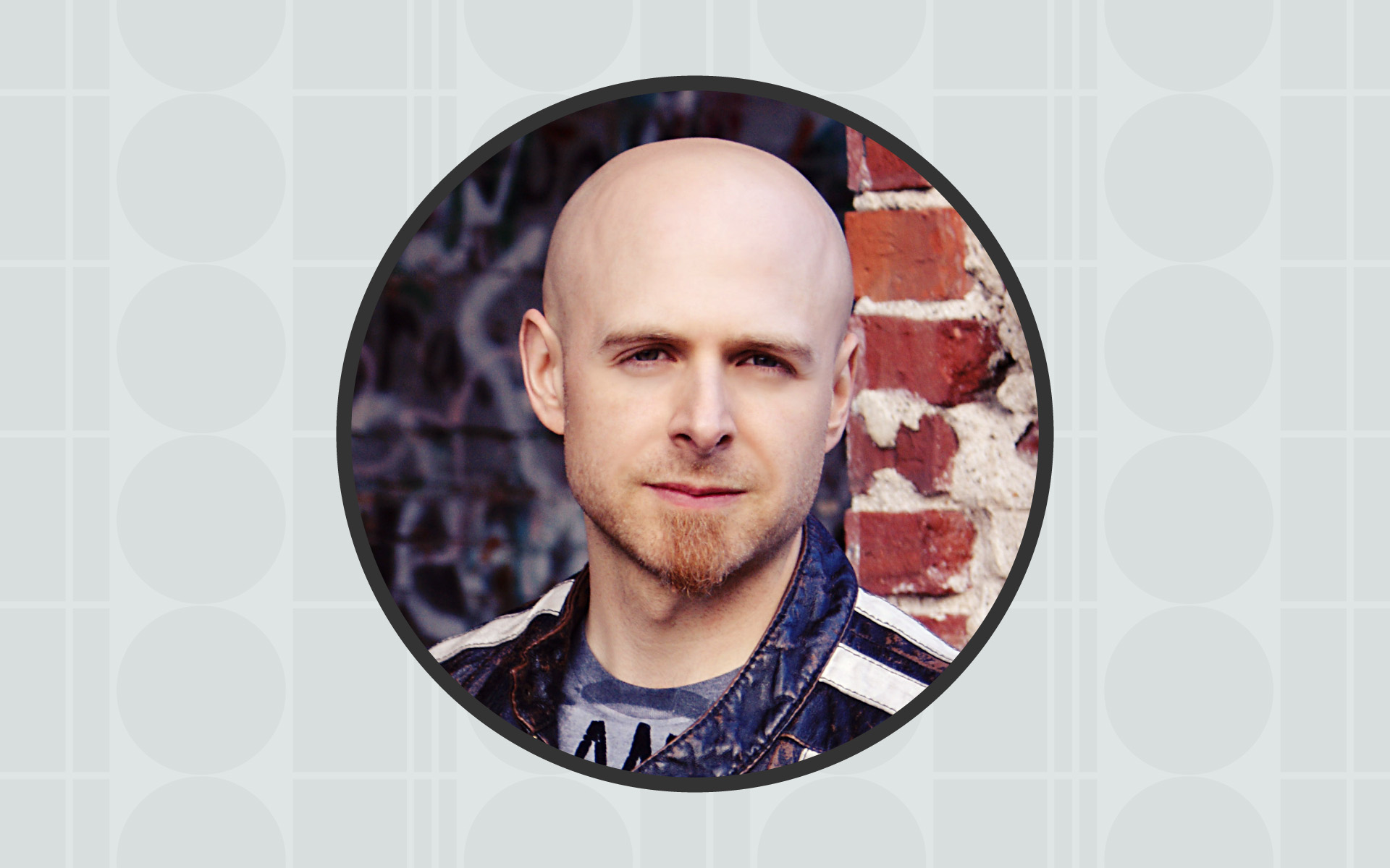 A portrait of Berklee Online instructor Shaun Michaud framed inside of a circle, with a gray background.